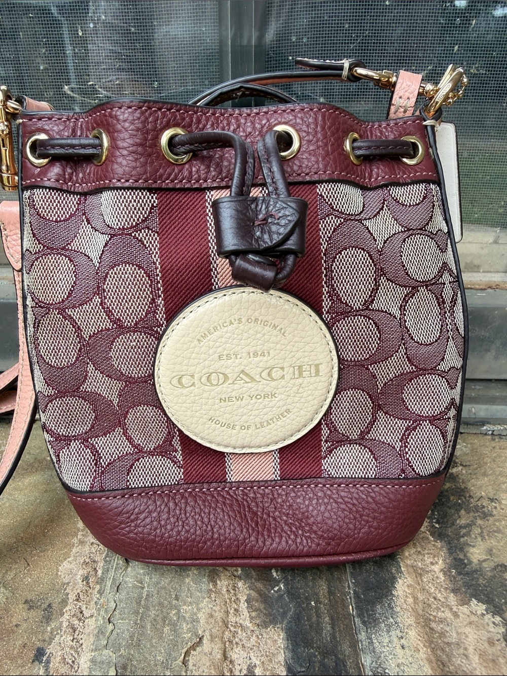Coach Burgundy Signature Stripe Drawstring Crossbody with Cream Medallion